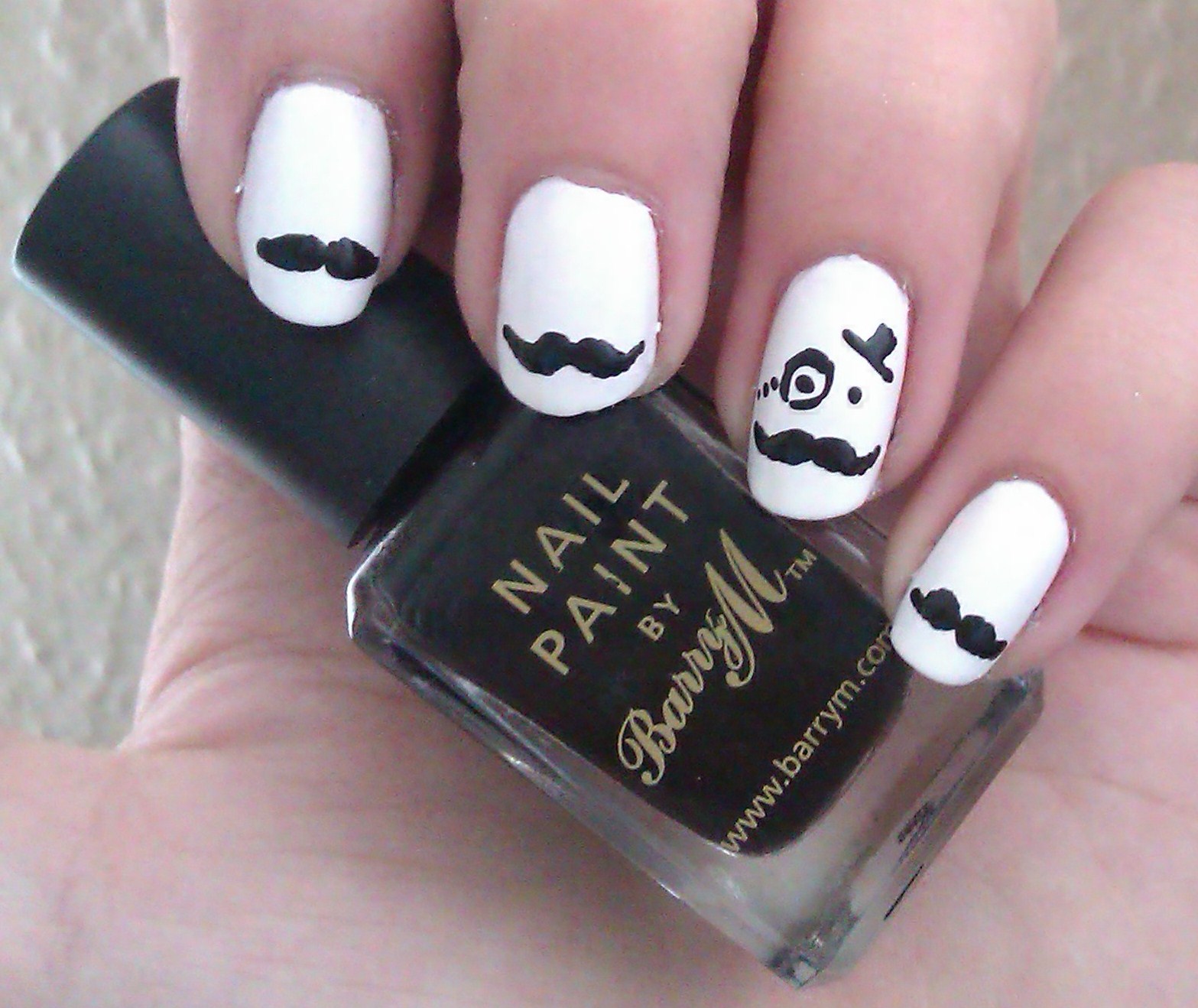 White Nails with Mustaches and a Face with Monocle and Hat